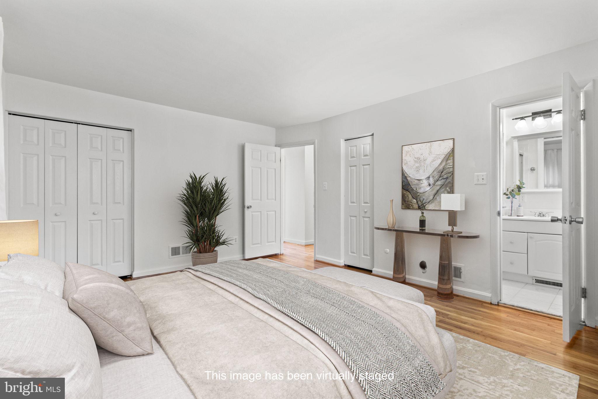 9703 Singleton Drive Bethesda, MD 20817 - Photo 11 of 22 a bedroom with a bed and a window