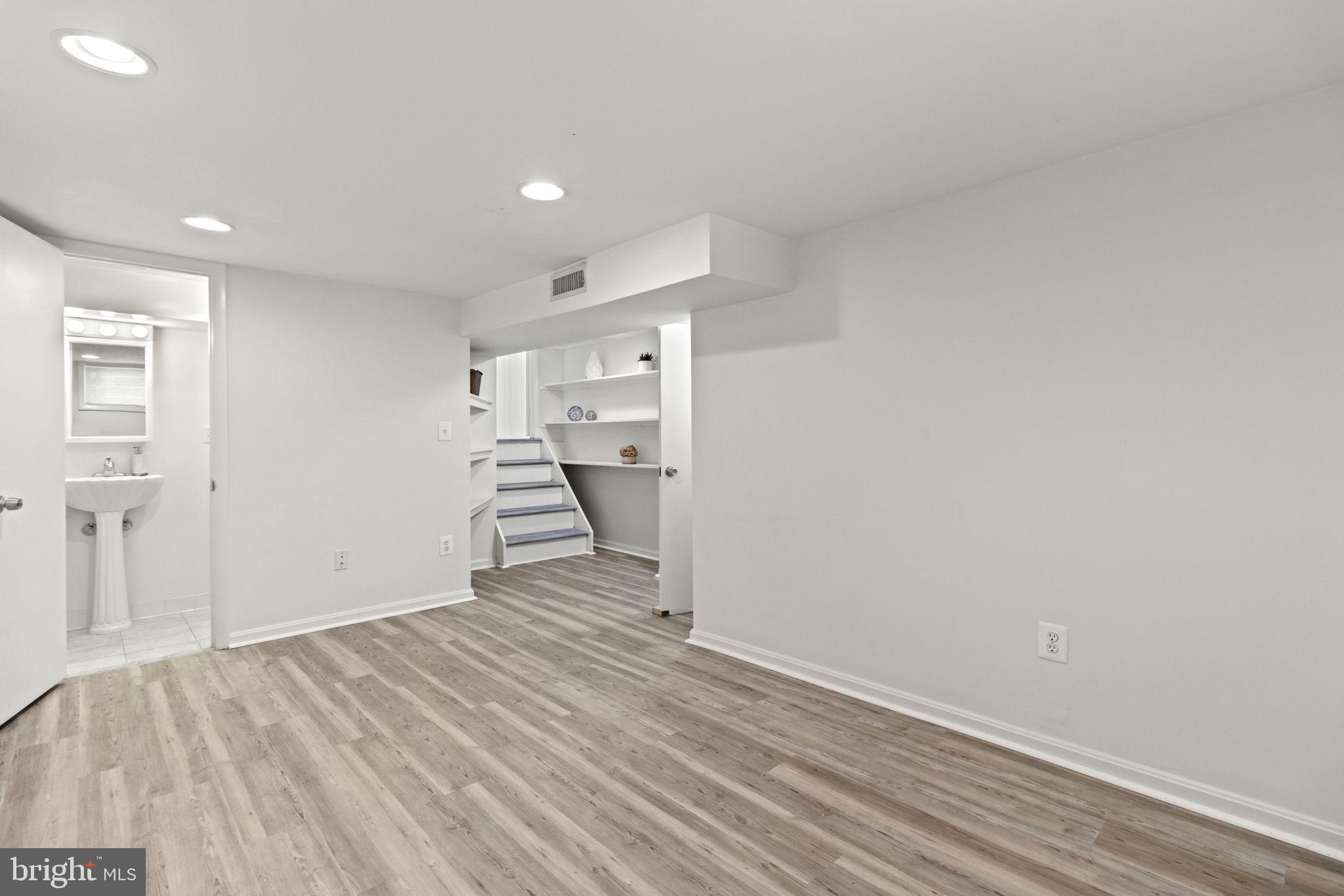 9703 Singleton Drive Bethesda, MD 20817 - Photo 19 of 22 a view of empty room with wooden floor