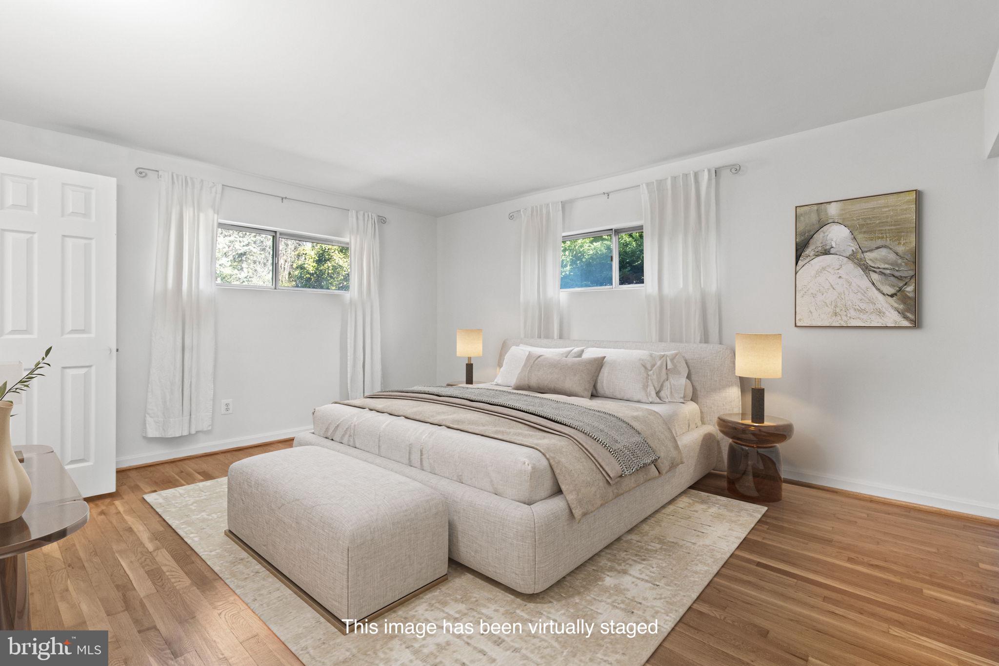 9703 Singleton Drive Bethesda, MD 20817 - Photo 10 of 22 a bedroom with a bed and a window