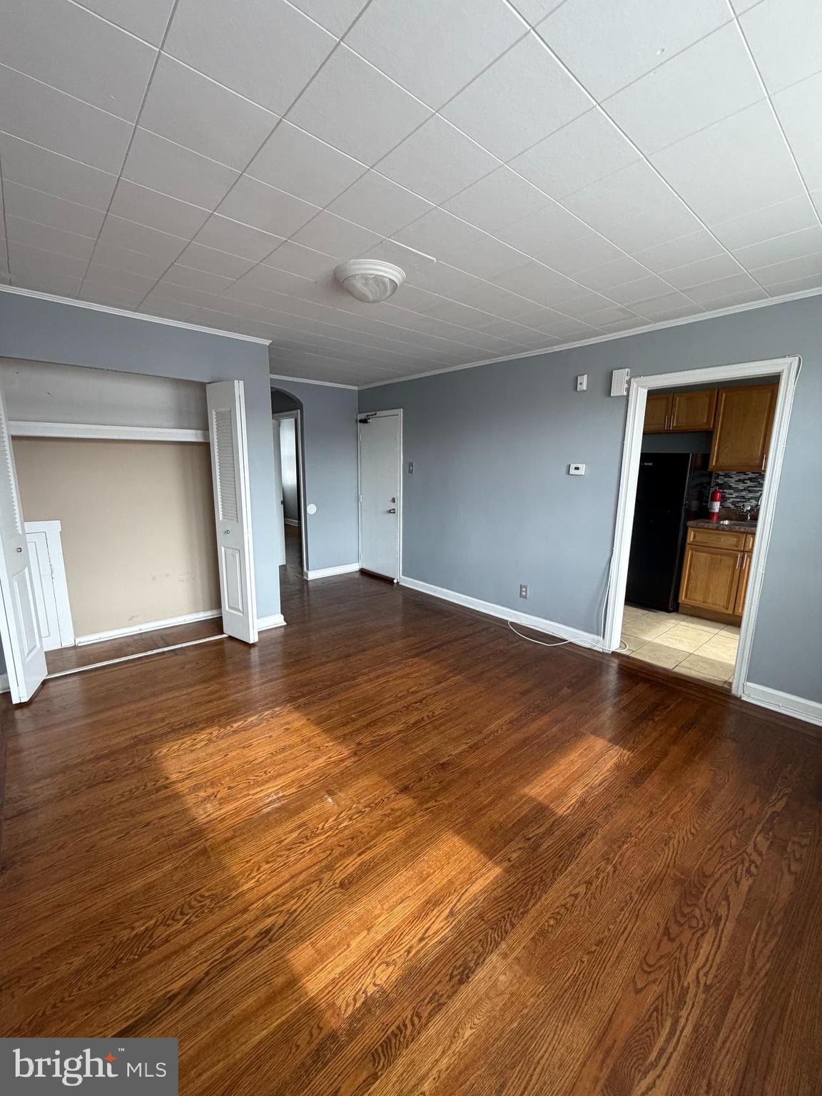 6404 Marsden Street Philadelphia, PA 19135 - Photo 6 of 8 an empty room with wooden floor and closet