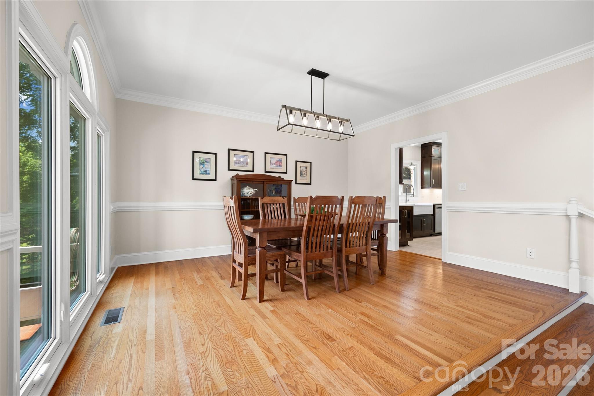636 Landsdowne Court Fort Mill, SC 29708 - Photo 9 of 48 a view of a dining room with furniture and wooden floor