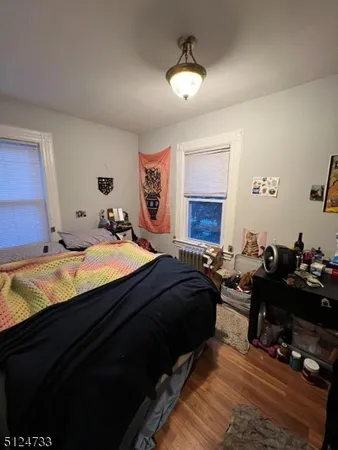 a bed room with a bed and a chandelier