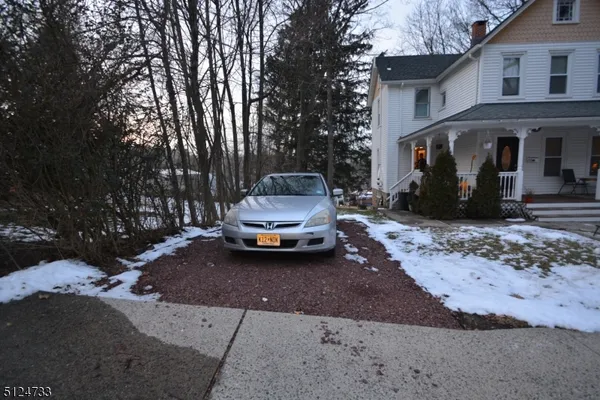 a car parked in front of a house