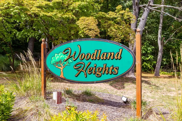 a sign broad on a brick wall