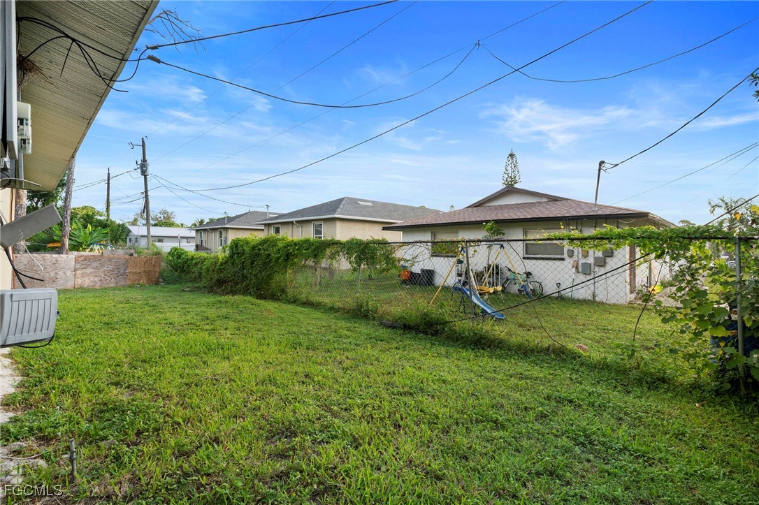 5539 Tenth Avenue Fort Myers, FL 33907 - Photo 17 of 20 a front view of a house with a yard