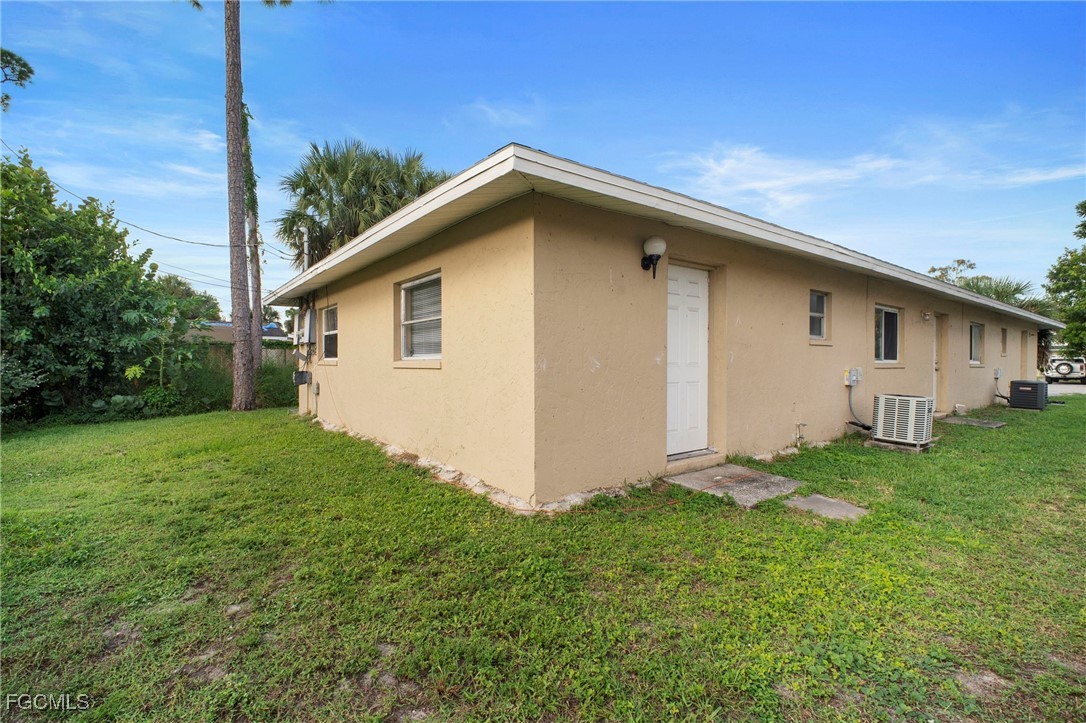 5539 Tenth Avenue Fort Myers, FL 33907 - Photo 2 of 20 a view of backyard of house with green space