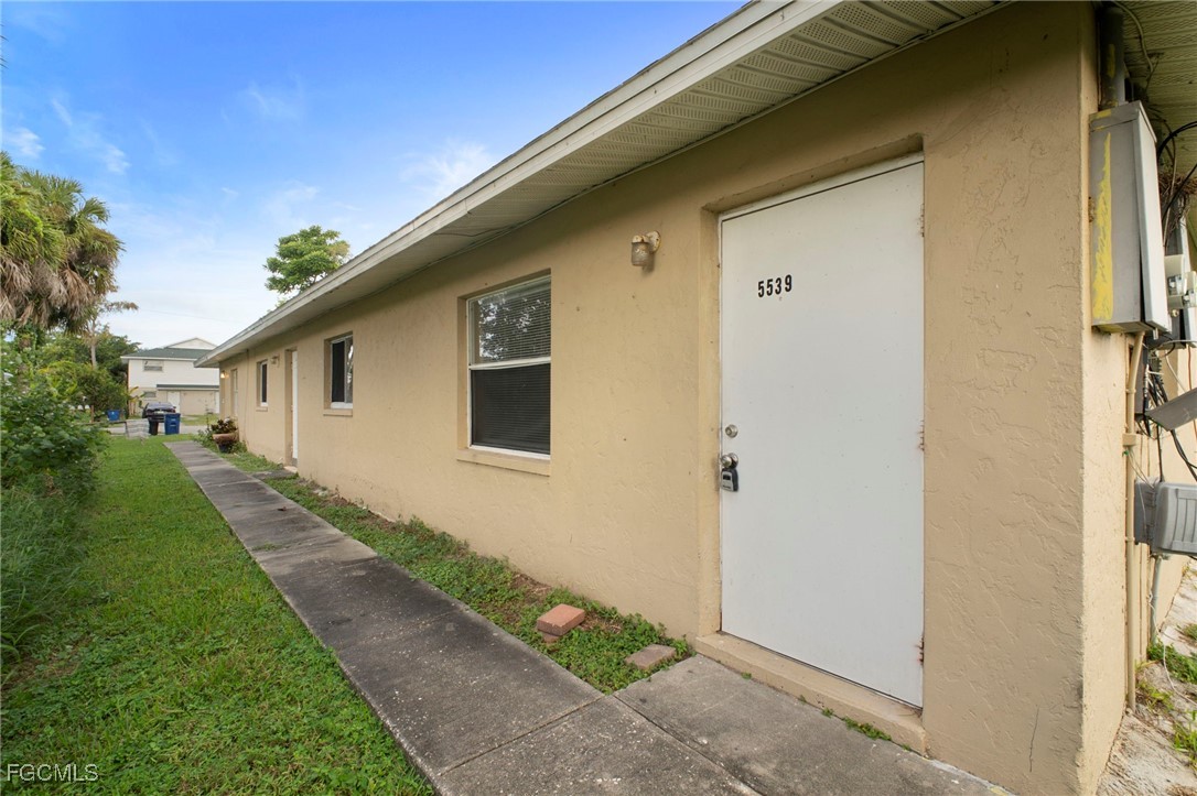 5539 Tenth Avenue Fort Myers, FL 33907 - Photo 3 of 20 a front view of a house with a yard