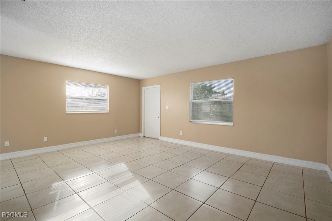 5539 Tenth Avenue Fort Myers, FL 33907 - Photo 7 of 20 a view of an empty room with windows