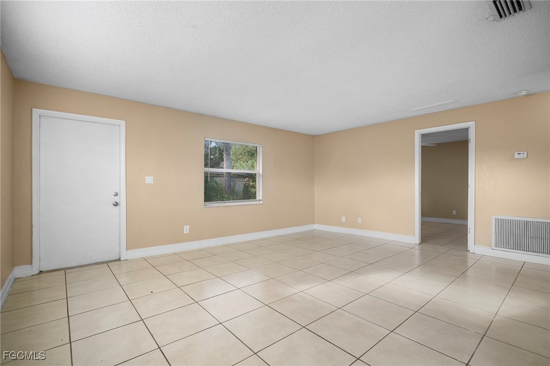 5539 Tenth Avenue Fort Myers, FL 33907 - Photo 8 of 20 a view of an empty room with a window
