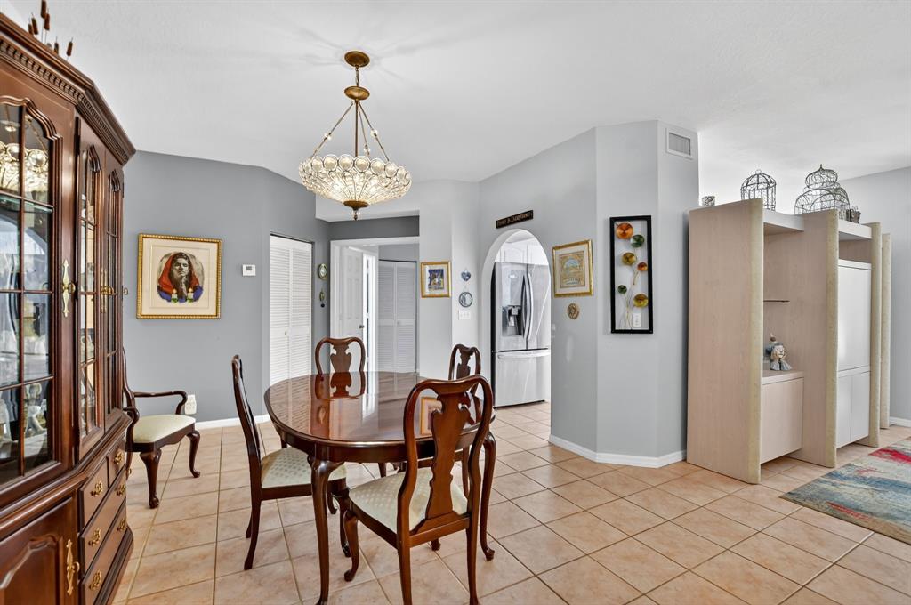 12614 Tiboli Chase Court, Unit 1 Boca Raton, FL 33496 - Photo 13 of 62 a dining room with furniture and window