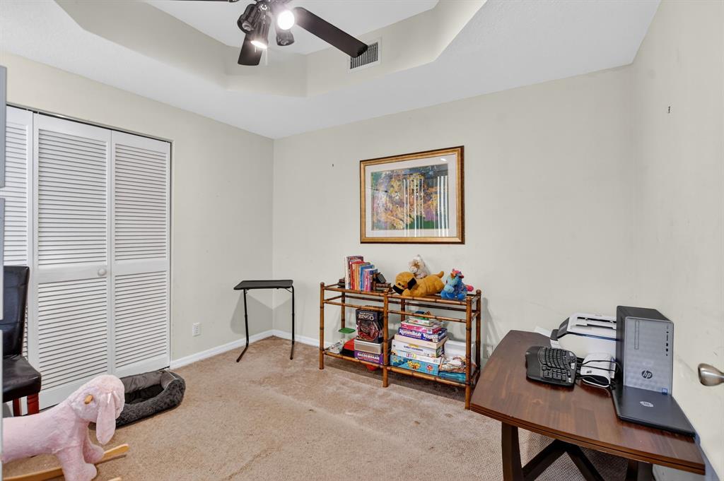 12614 Tiboli Chase Court, Unit 1 Boca Raton, FL 33496 - Photo 23 of 62 a view of a workspace with furniture and a window