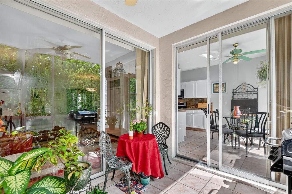 12614 Tiboli Chase Court, Unit 1 Boca Raton, FL 33496 - Photo 32 of 62 a living room filled with furniture and a potted plant