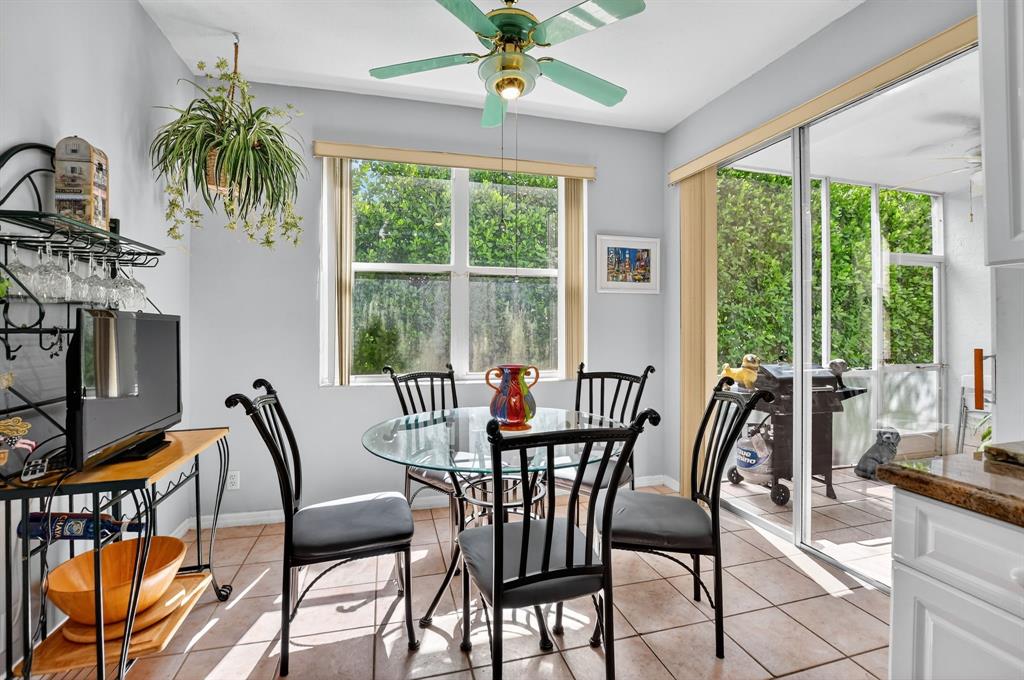 12614 Tiboli Chase Court, Unit 1 Boca Raton, FL 33496 - Photo 4 of 62 a view of a dining room with furniture window and outside view
