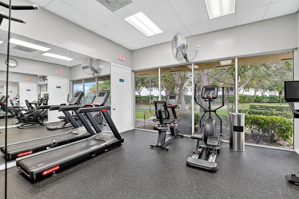 12614 Tiboli Chase Court, Unit 1 Boca Raton, FL 33496 - Photo 57 of 62 a view of a room with gym equipment
