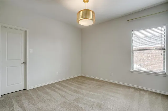 an empty room with a empty space and a window