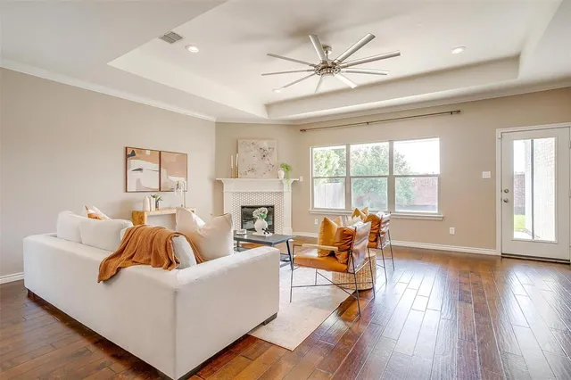 a living room with furniture and a fireplace