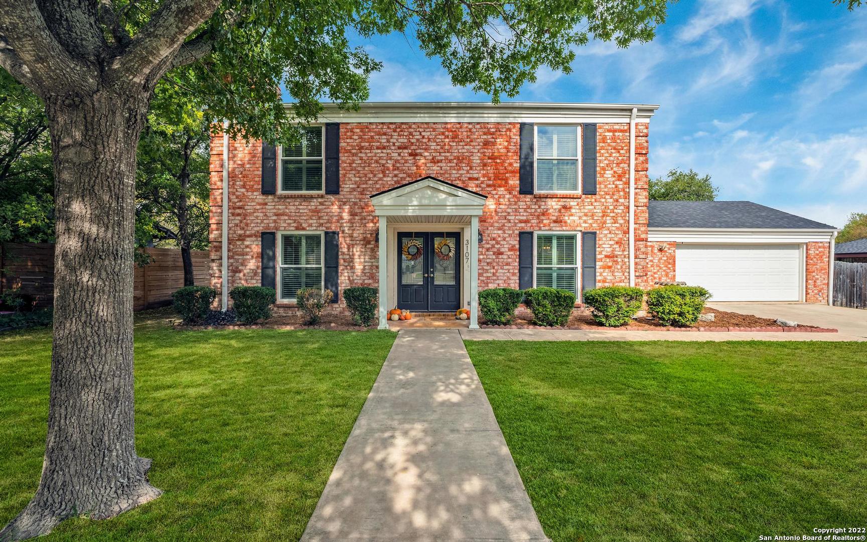 a front view of a house with yard