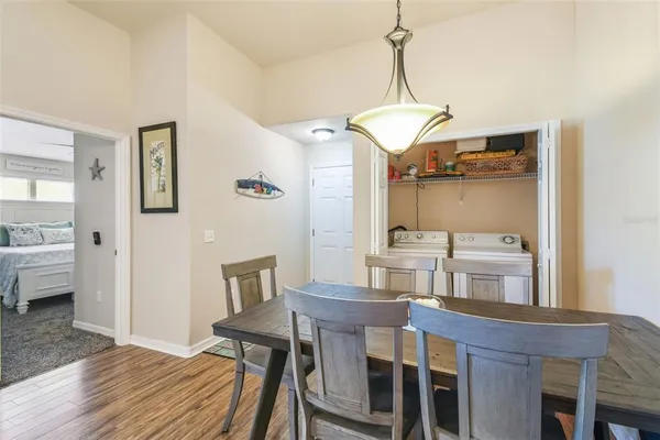 a view of a dining room with furniture window and wooden floor