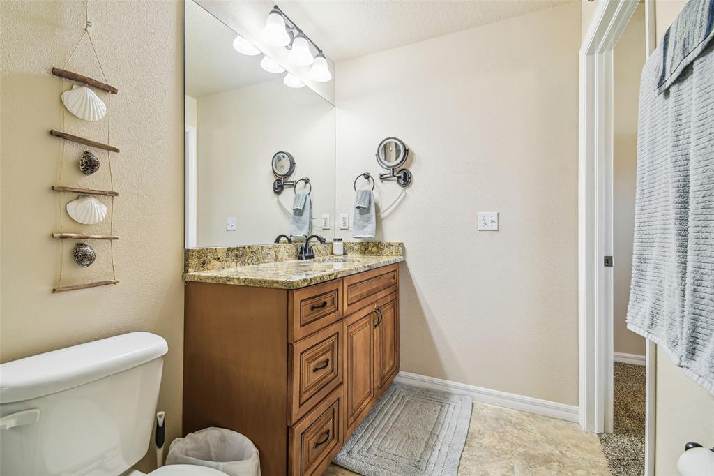 5088 Royal Palms Way, Unit 304 New Port Richey, FL 34652 - Photo 24 of 93 a bathroom with a sink a toilet and shower