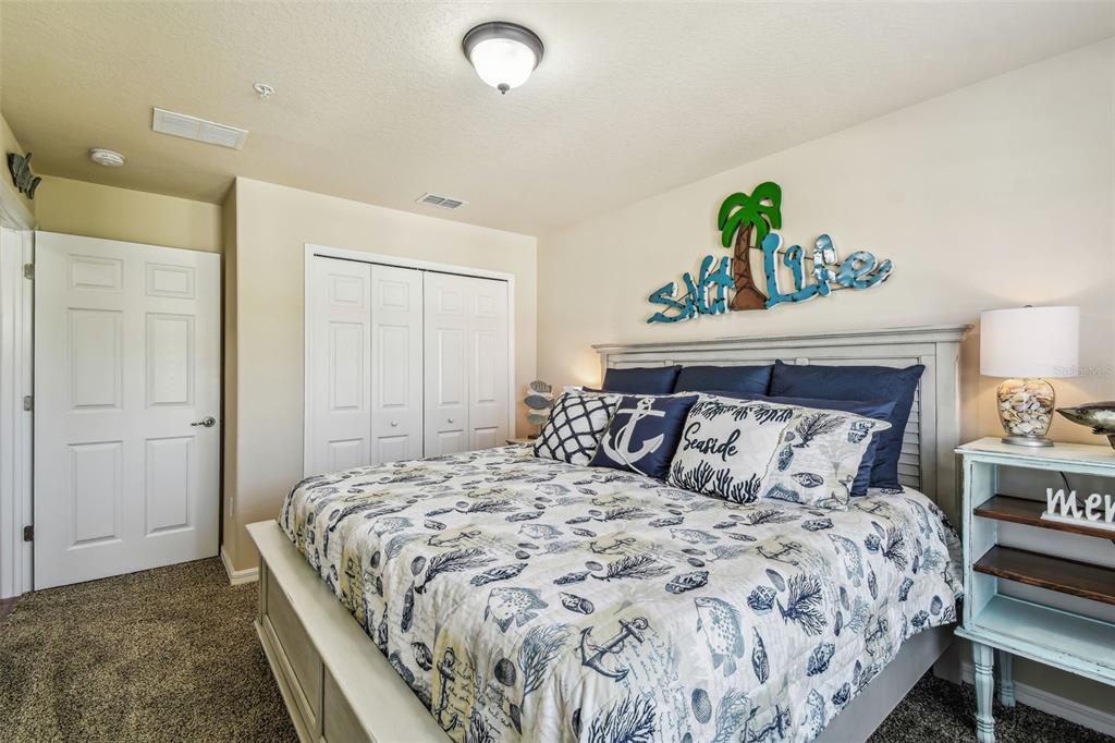 5088 Royal Palms Way, Unit 304 New Port Richey, FL 34652 - Photo 27 of 93 a bedroom with a bed and a window