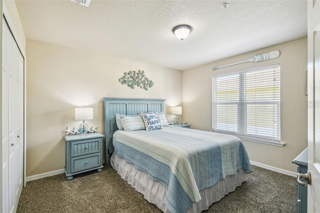 5088 Royal Palms Way, Unit 304 New Port Richey, FL 34652 - Photo 30 of 93 a bedroom with a bed and a window