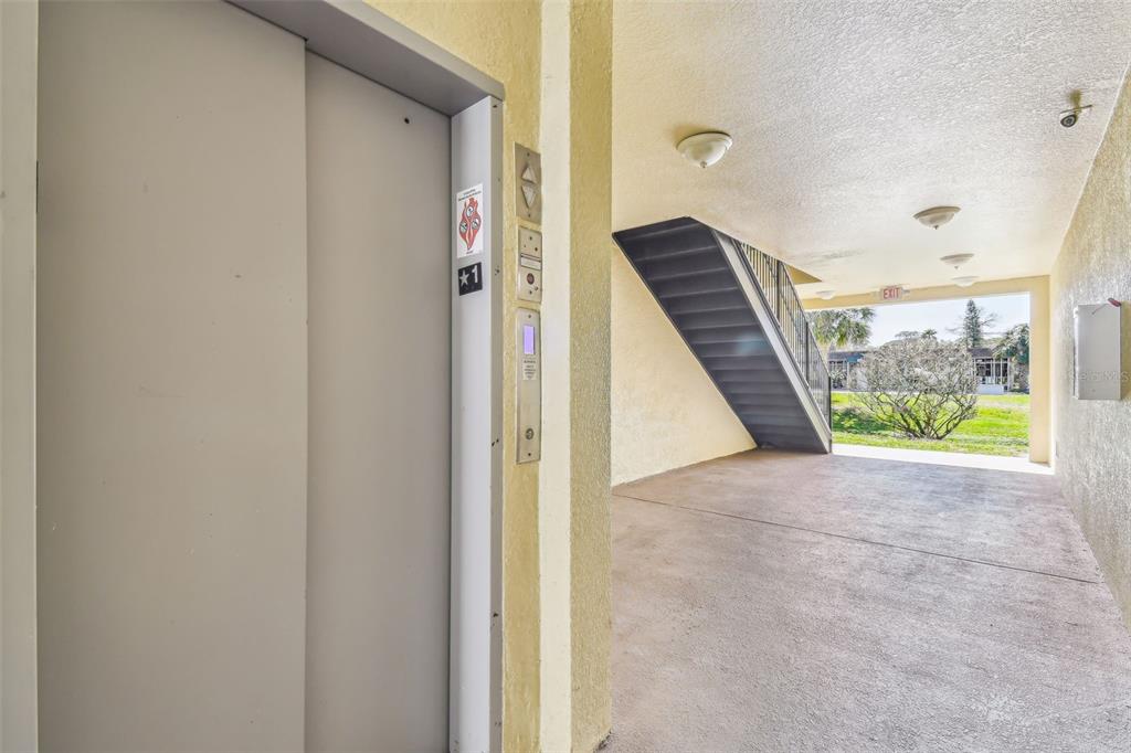 5088 Royal Palms Way, Unit 304 New Port Richey, FL 34652 - Photo 39 of 93 a view of an entryway with staircase