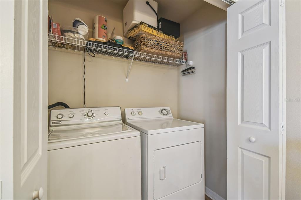 5088 Royal Palms Way, Unit 304 New Port Richey, FL 34652 - Photo 49 of 93 a utility room with dryer and washer