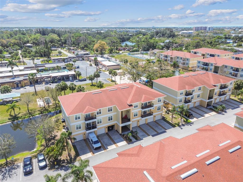 5088 Royal Palms Way, Unit 304 New Port Richey, FL 34652 - Photo 66 of 93 an aerial view of residential houses and outdoor space