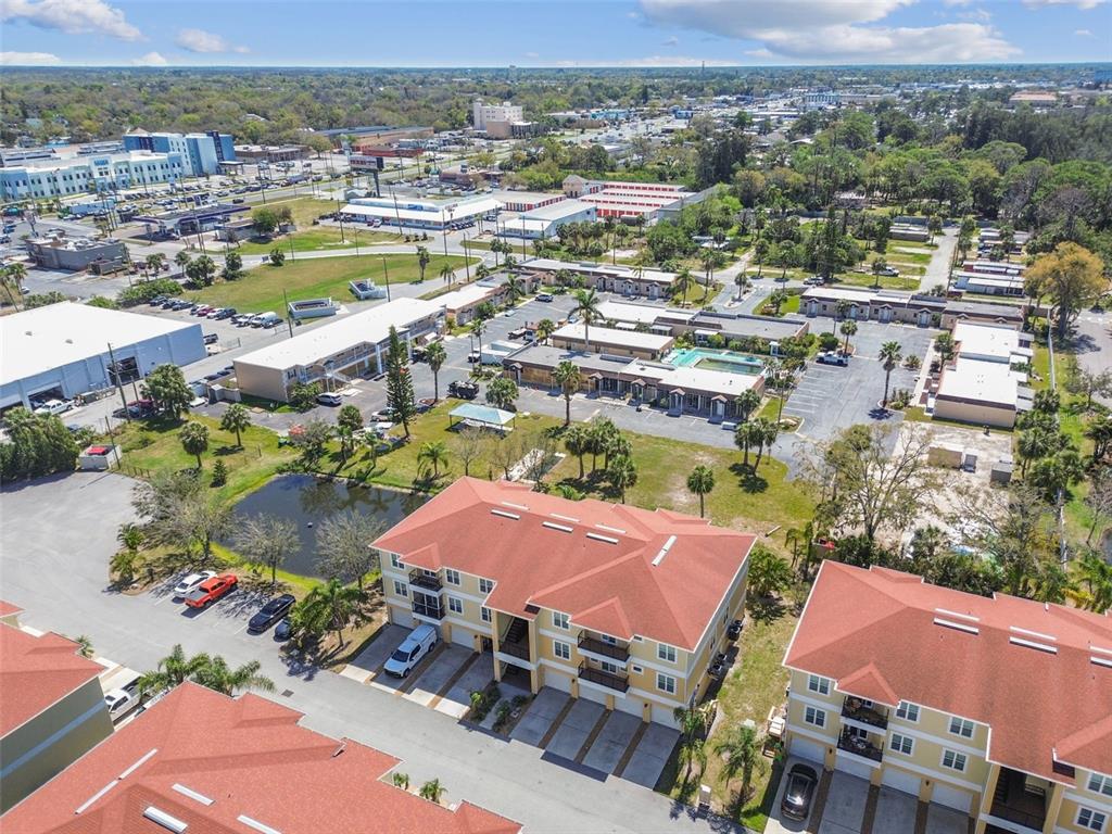 5088 Royal Palms Way, Unit 304 New Port Richey, FL 34652 - Photo 68 of 93 an aerial view of residential houses with outdoor space