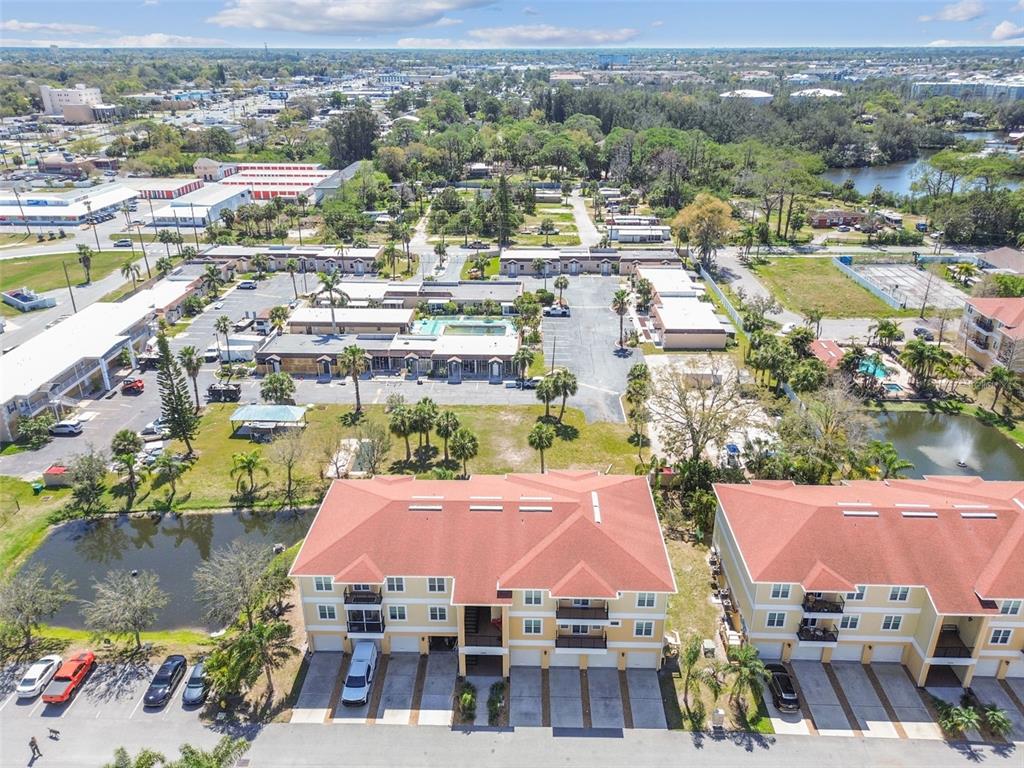 5088 Royal Palms Way, Unit 304 New Port Richey, FL 34652 - Photo 69 of 93 an aerial view of residential houses and lake view