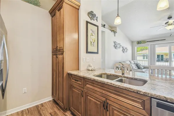 a kitchen with a sink and a refrigerator