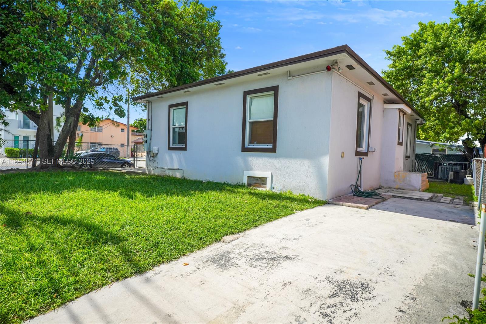 2155 Northwest 28th Street Miami, FL 33142 - Photo 16 of 18 a front view of house with yard