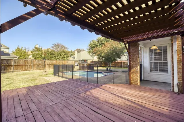 a view of outdoor space with wooden deck