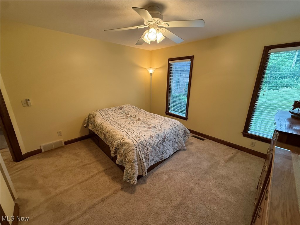2597 Pyle Road Dover, OH 44622 - Photo 36 of 50 Bedroom with light carpet and ceiling fan
