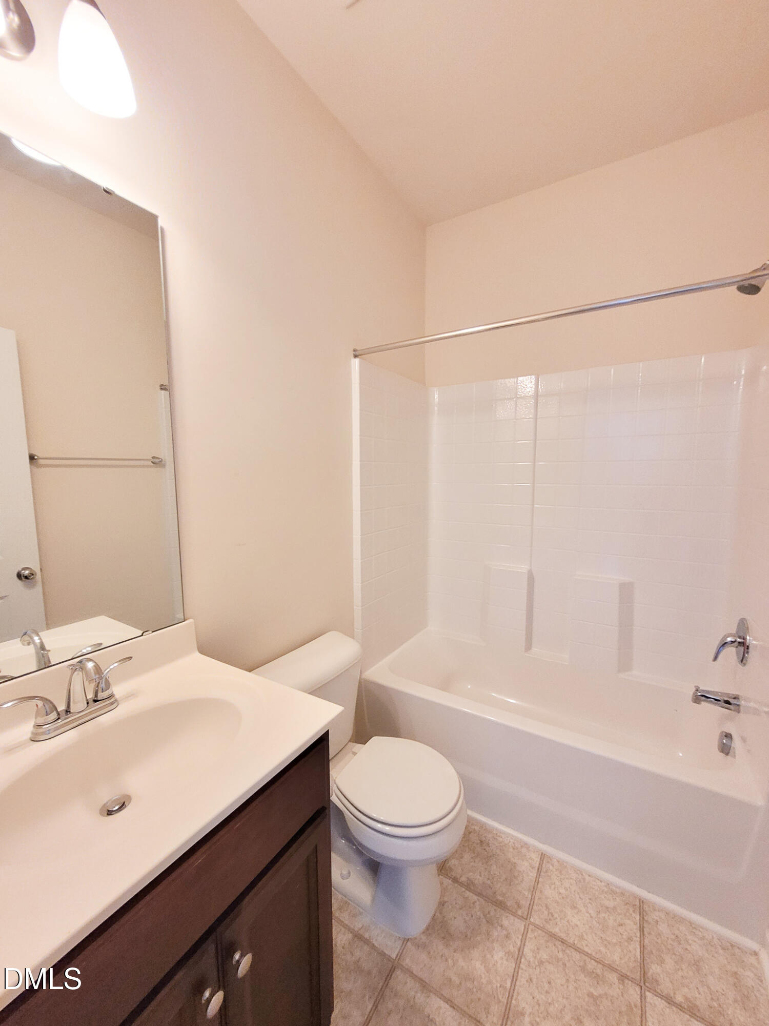 8951 Commons Townes Drive Raleigh, NC 27616 - Photo 35 of 40 a bathroom with a sink a toilet and shower
