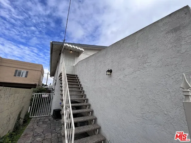 a view of a hallway with stairs