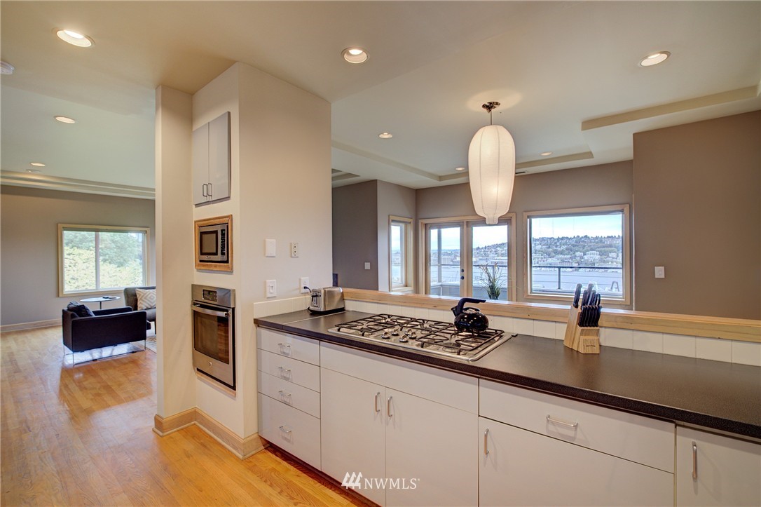 1909 Broadway East Seattle, WA 98102 - Photo 15 of 25 a kitchen with a sink stove and cabinets