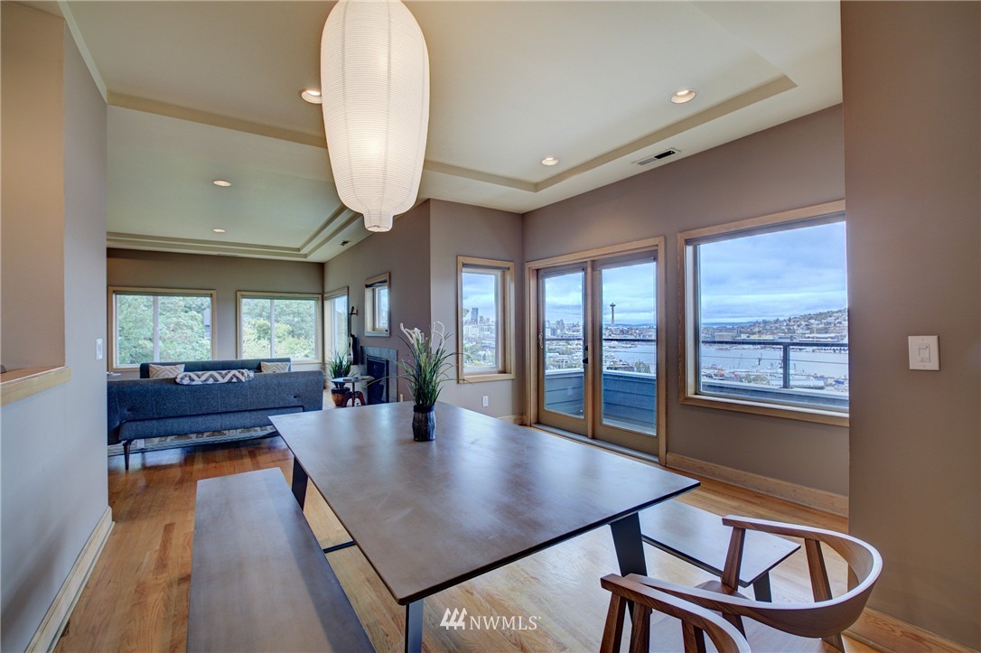 1909 Broadway East Seattle, WA 98102 - Photo 16 of 25 a view of a dining room with furniture window and wooden floor