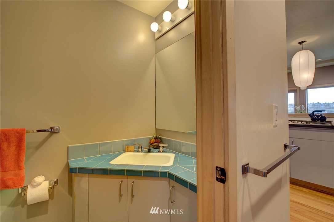 1909 Broadway East Seattle, WA 98102 - Photo 18 of 25 a bathroom with a sink and a mirror