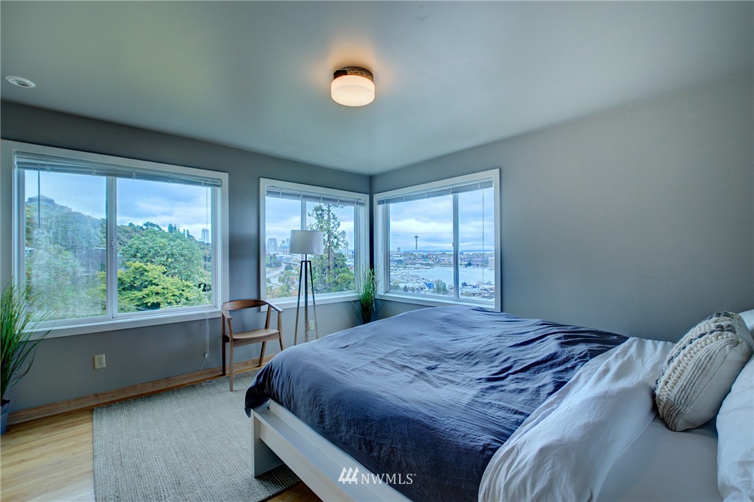 1909 Broadway East Seattle, WA 98102 - Photo 21 of 25 a bed sitting in a bedroom next to a window