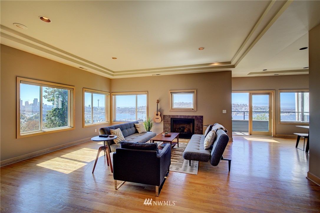 1909 Broadway East Seattle, WA 98102 - Photo 4 of 25 a living room with furniture and a fireplace