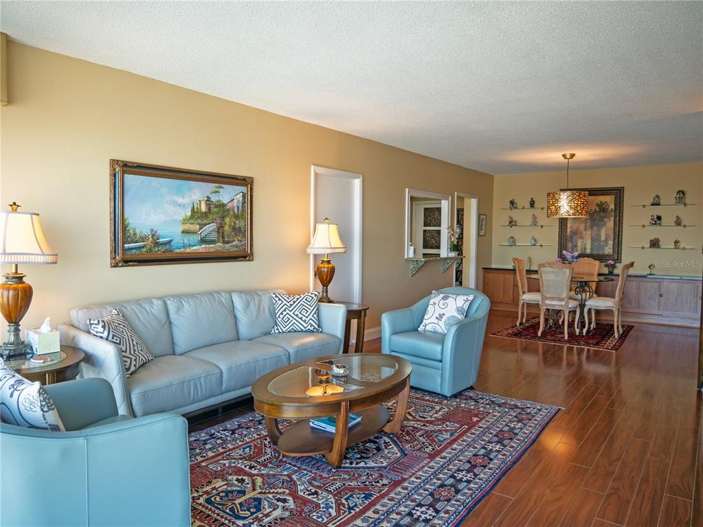 100 Pierce Street, Unit 1301 Clearwater, FL 33756 - Photo 11 of 44 a living room with furniture and a table