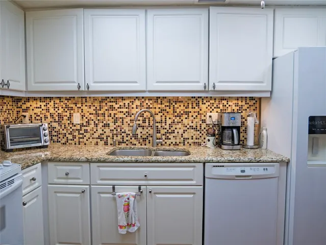 a bedroom with a bed and a television in it