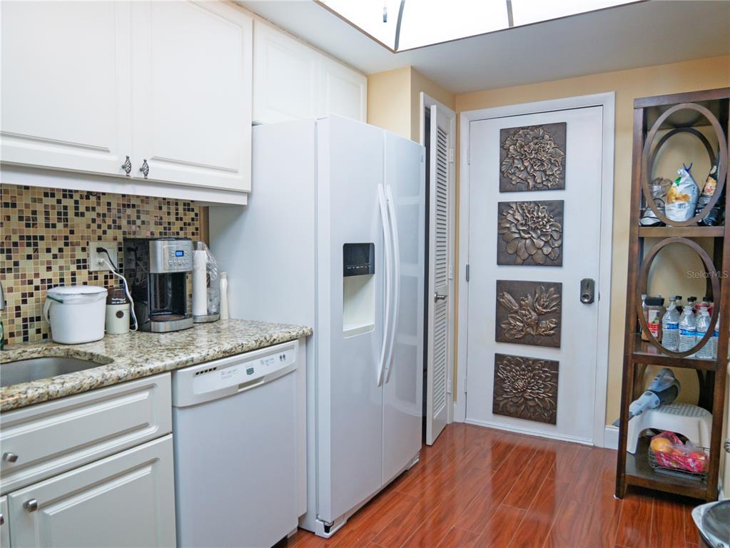 100 Pierce Street, Unit 1301 Clearwater, FL 33756 - Photo 16 of 44 a kitchen with refrigerator and stove