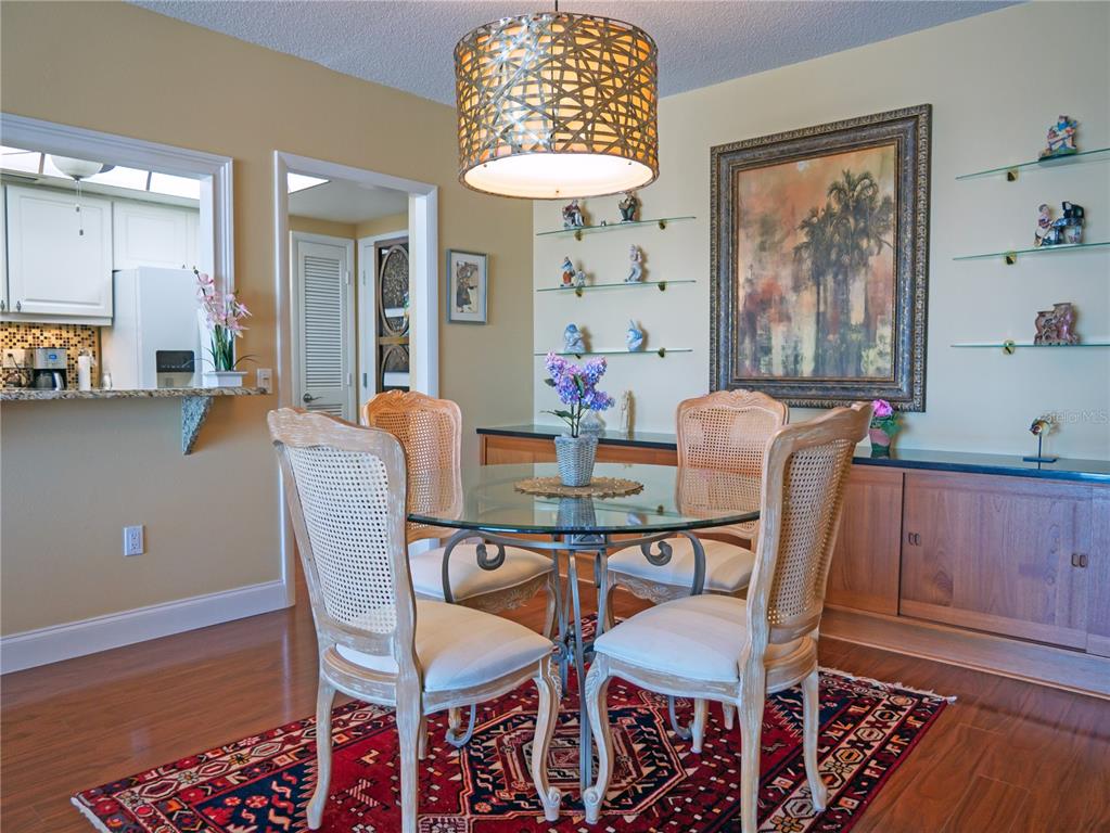 100 Pierce Street, Unit 1301 Clearwater, FL 33756 - Photo 18 of 44 a dining room with furniture and window