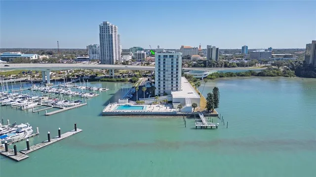 a view of a lake with a table and chairs