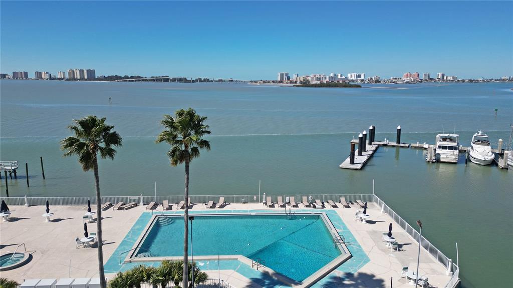 100 Pierce Street, Unit 1301 Clearwater, FL 33756 - Photo 3 of 44 a view of a lake with a table and chairs