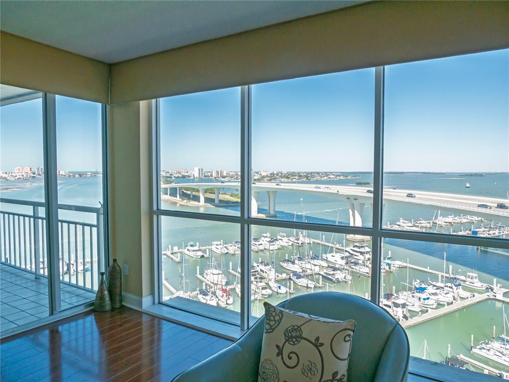 100 Pierce Street, Unit 1301 Clearwater, FL 33756 - Photo 9 of 44 a living room with furniture and a floor to ceiling window