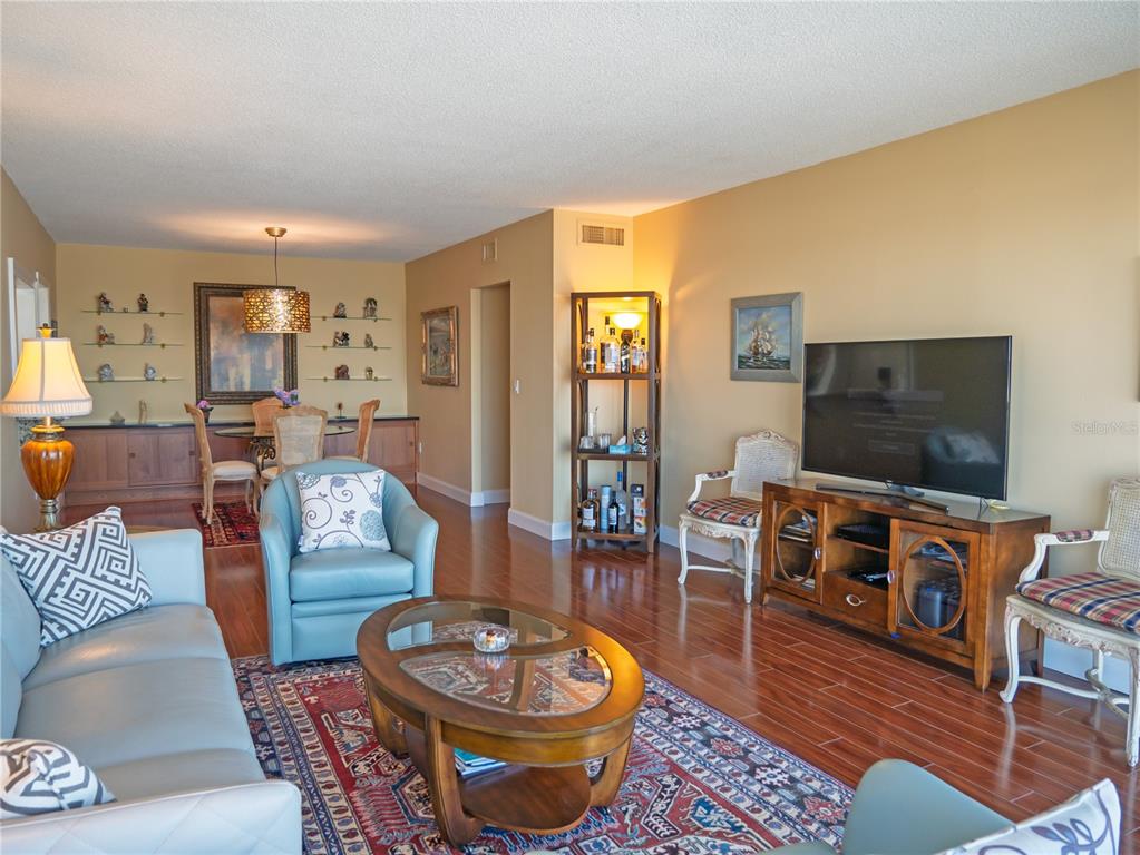 100 Pierce Street, Unit 1301 Clearwater, FL 33756 - Photo 10 of 44 a living room with furniture and a flat screen tv