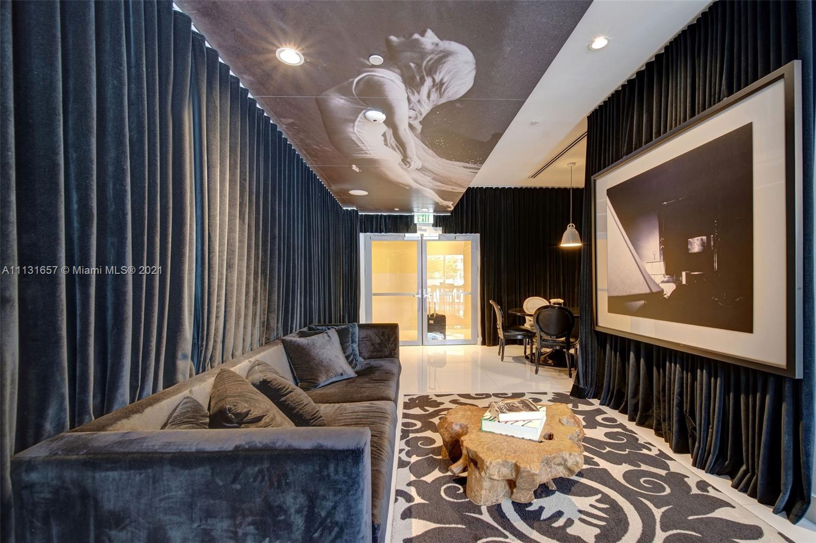 495 Brickell Avenue, Unit 4907 Miami, FL 33131 - Photo 11 of 20 a living room with furniture and a large window